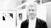 David Lynch looking at the camera at his first photo exhibition in Germany in 2008