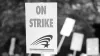 A protest sign reading "on strike"